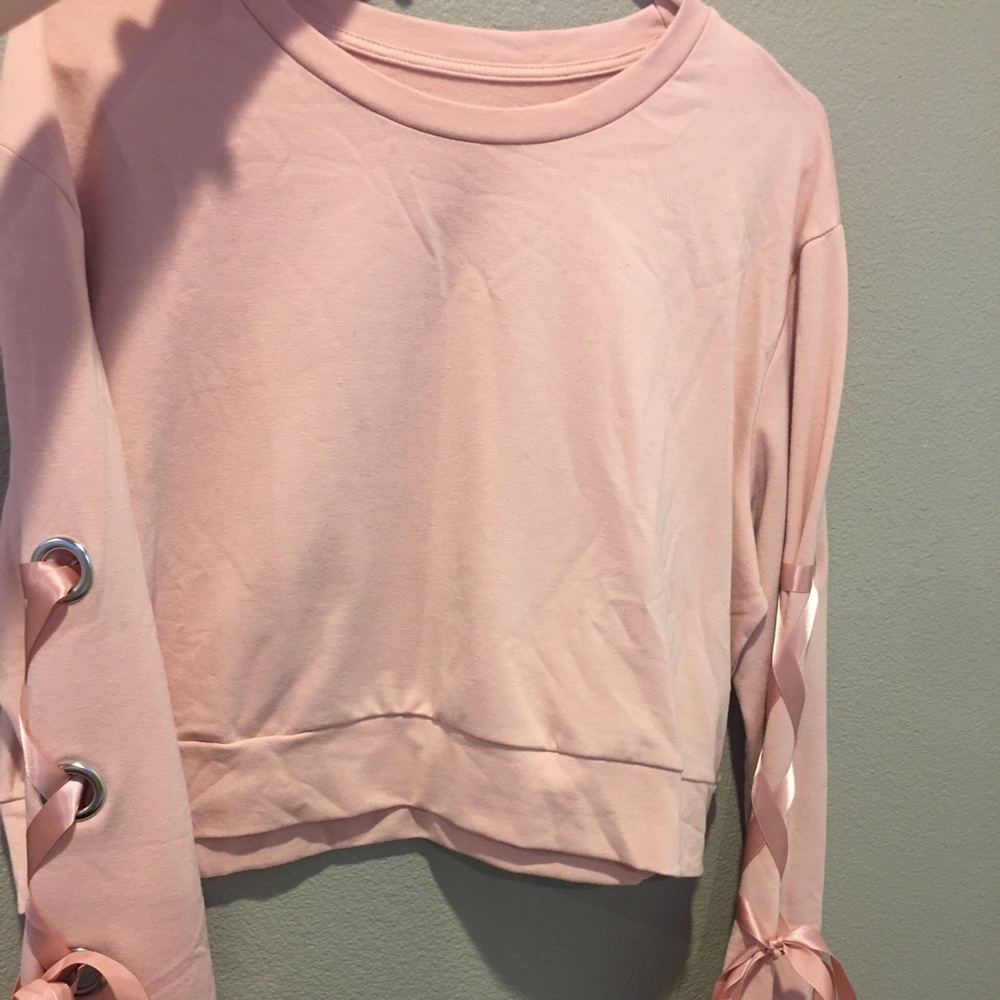 Pink lace up sleeve crop top.